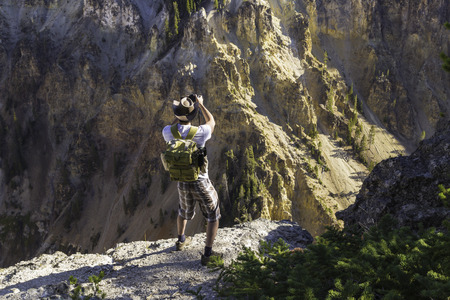 Yellowstone National Park, Wyoming, United States September 20, 2014 ? A photographer taking a shot of the mini grand canyon in Yellowstone National Park.のeditorial素材