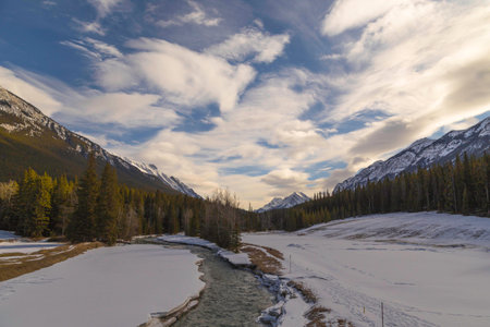 A shot of the bow river passing through Banff under a big blue sky.の写真素材