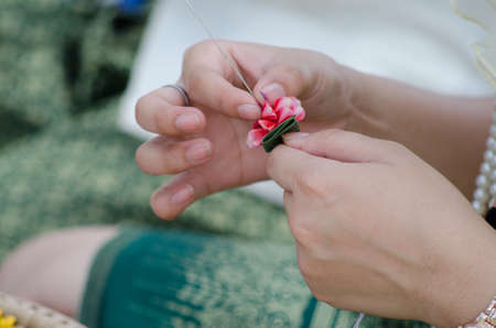 The garland made from flowers is an art and culture of Thailand. Thai culture style.の写真素材