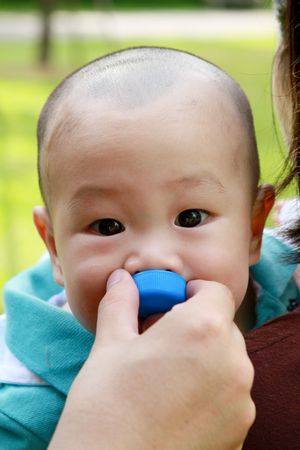 baby drinking waterの写真素材