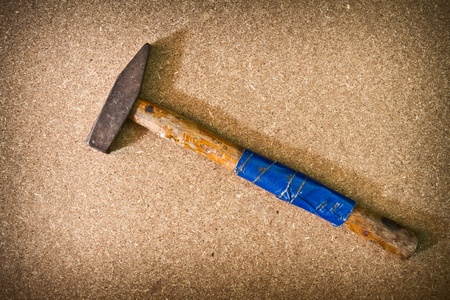 Hammer on wood の写真素材
