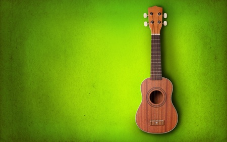 Ukulele on green backgroundの写真素材