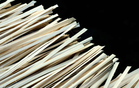 Raw material bamboo stripes isolate on black backgroundの写真素材