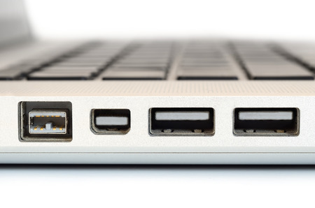 Show sideview closeup up of computer laptop selective focus on firewire portの写真素材
