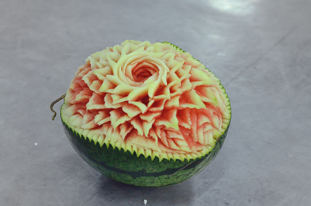 ripe watermelon with flower carvingの写真素材
