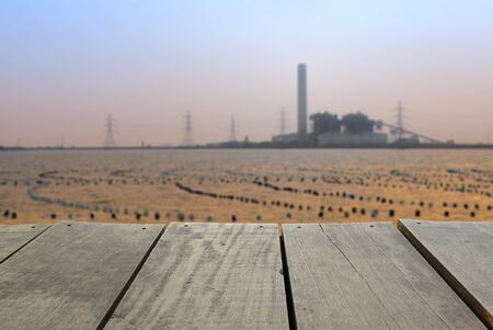 Defocused and blur image of terrace wood and Coal-Fired Power Plant industrial view for background usageの写真素材