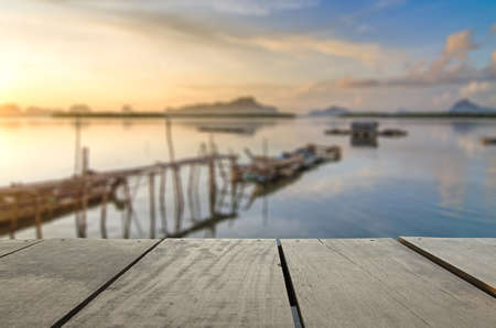 Defocused and blur image of terrace wood and beautiful seascape and morning view for background usageの写真素材