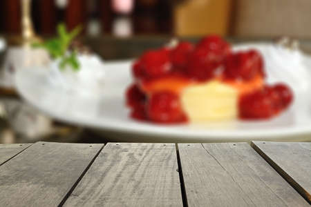 Defocus and blur image of terrace wood and blueberry cheesepie for background usageの写真素材