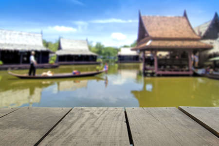 Defocus and blur image of terrace wood and Wooden boats busy ferrying people at floating market for background usageの写真素材