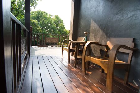 Wooden terrace and classic chair for background usageの写真素材