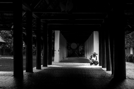 Old man sit under roof alone in home with dramatic styleのeditorial素材