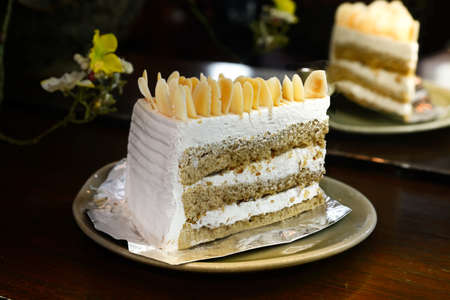 Coffee almond butter cake and cream in coffee shopの写真素材