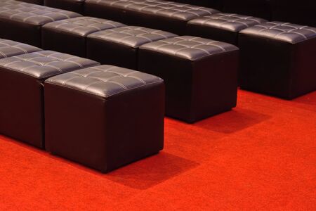 Beautiful sofa on red carpet for background