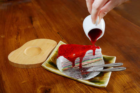 Crepe cake with strawberry sauce