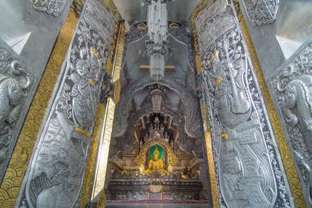 Golden ancient buddha in The silver ubosot (ordination hall) of Wat Srisuphan Temple ,Chiangmai ,Thailandのeditorial素材