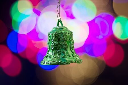 Christmas bells decorate over bokeh backgroundの写真素材