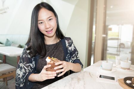 Beautiful asia woman enjoy eatingの写真素材