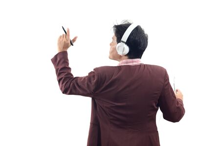 Businessman standing and holding pen and presentation in front of white background