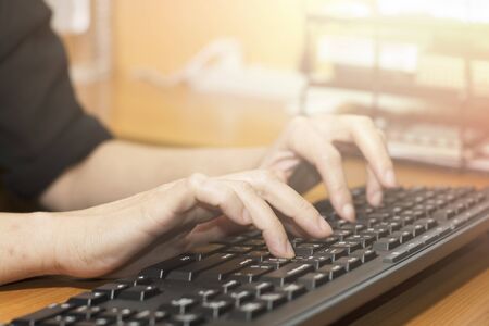Closeup hand and press on keyboardの写真素材