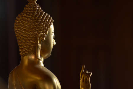 Golden of buddish state in the art style ,Wat Krathum Suea Pla temple ,Bangkokの写真素材