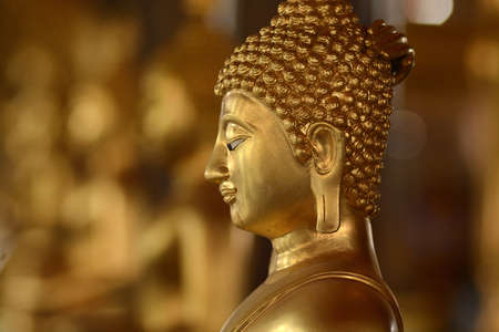 Golden of buddish state in the art style ,Wat Krathum Suea Pla temple ,Bangkokの写真素材