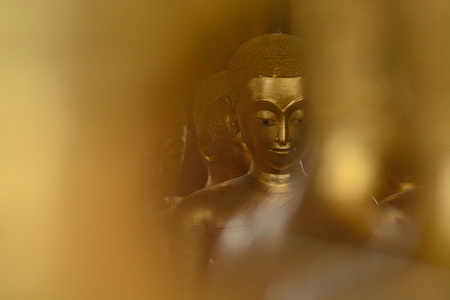 Ordained female monks or Bhikkunis surround Buddha's sculpture.These are some of the oldest and rarest Bhikkuni statues found in the world stay at Wat Thepthidaram temple.の写真素材