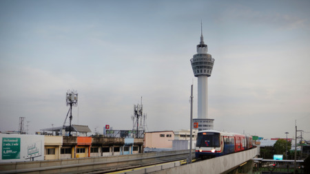 SAMUT PRAKAN, THAILAND - JANUARY 21, 2019: Landmark and New observation tower of Samut Prakan Province with train. Samut Prakan, Thailand.のeditorial素材