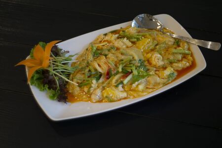 stir fried seafood curry powder. This is a popular menu in Thai restaurant.の写真素材