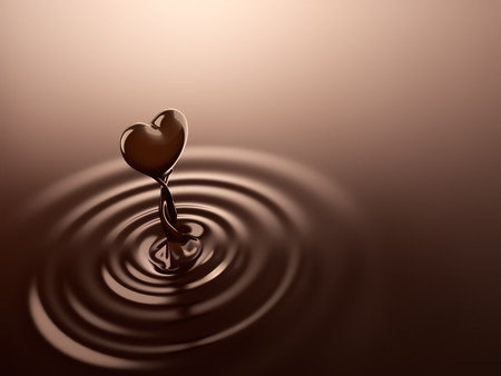 Heart shape chocolate rising from chocolate ripplesの写真素材