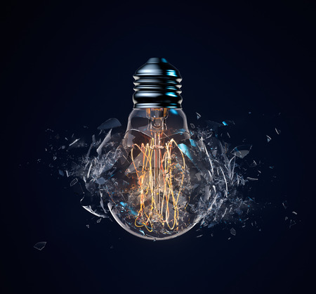 Exploding light bulb on a dark blue background