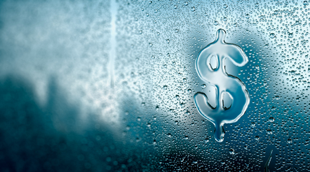 Water drop forming a Dollar signの写真素材