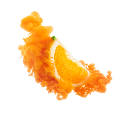 Orange fruit on ink isolated over white backgroundの写真素材