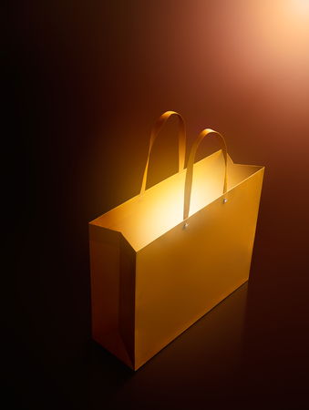 Gold shopping bag with glowの写真素材