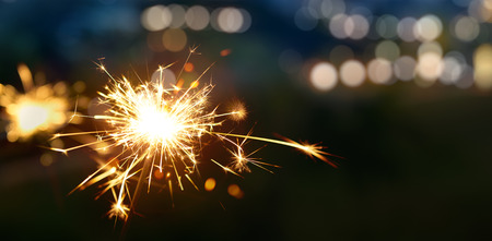 Sparkler with blurred bokeh light backgroundの写真素材