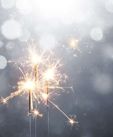 Glittering sparklers, Merry Christmas and Happy New Yearの写真素材