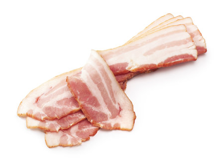 Raw bacon slices isolated on white backgroundの写真素材