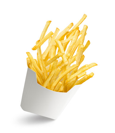 French fries bursting out from white paper box isolated on whiteの写真素材