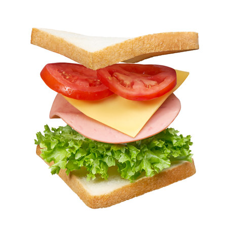 Fresh white bread sandwich with layers of ingredients isolatedの写真素材