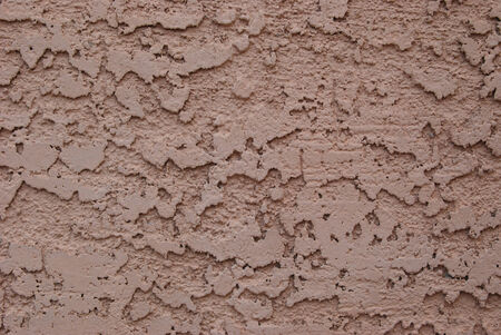 Closeup of a tan Stucco backgroundの写真素材