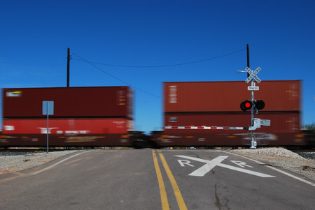 Picacho, AZ, USA - October 18, 2014: Train loaded with  containers passing through a railroad crossing. Taken October 18, 2014のeditorial素材