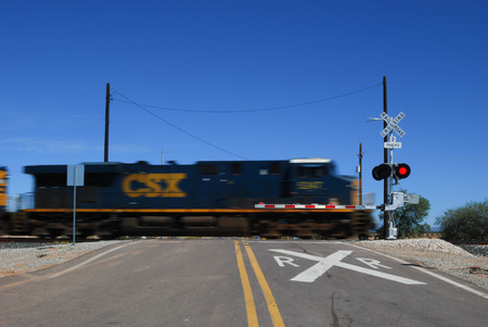 Picacho, AZ, USA - October 18, 2014: A speed blur of a locomotive passing through a railroad crossing. Taken October 18, 2014のeditorial素材