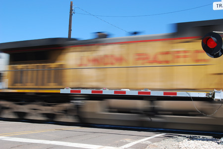 Picacho, AZ, USA - October 18, 2014: A speed blur of a locomotive passing through a railroad...