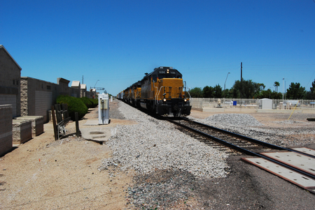 An oncoming freight train in a desert area of Mesa, AZの写真素材