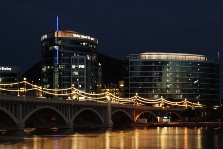 Tempe, Arizona, - USA - September 2, 2015: Night time exposure of  the newest modern office buildings at Tempe Town Lake with the Mill Ave Bridge in foreground.のeditorial素材