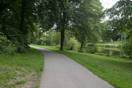 The path in Furpach city park. People go for walks or to rest in this small park.の写真素材