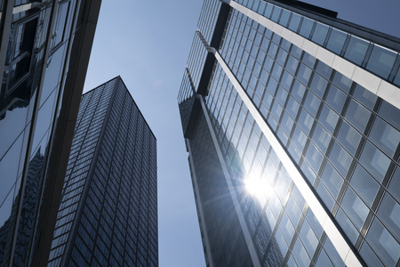 A view of office buildings in the downtown Frankfurt, Germany financial district. Sun is reflecting off the windows.の写真素材