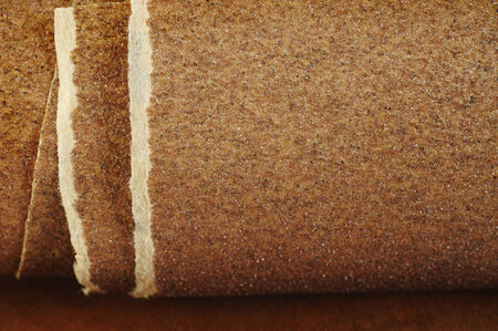 Sandpaper on wooden background