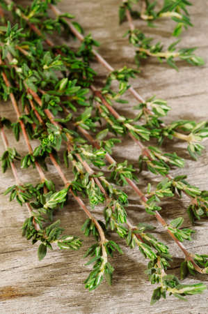fresh thyme on wooden backgroundの写真素材