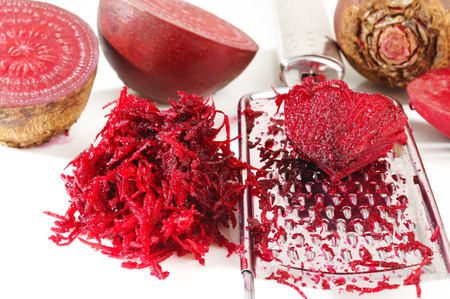 grated beets on a white backgroundの写真素材