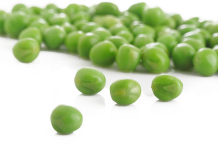 cooked green peas on whiteの写真素材
